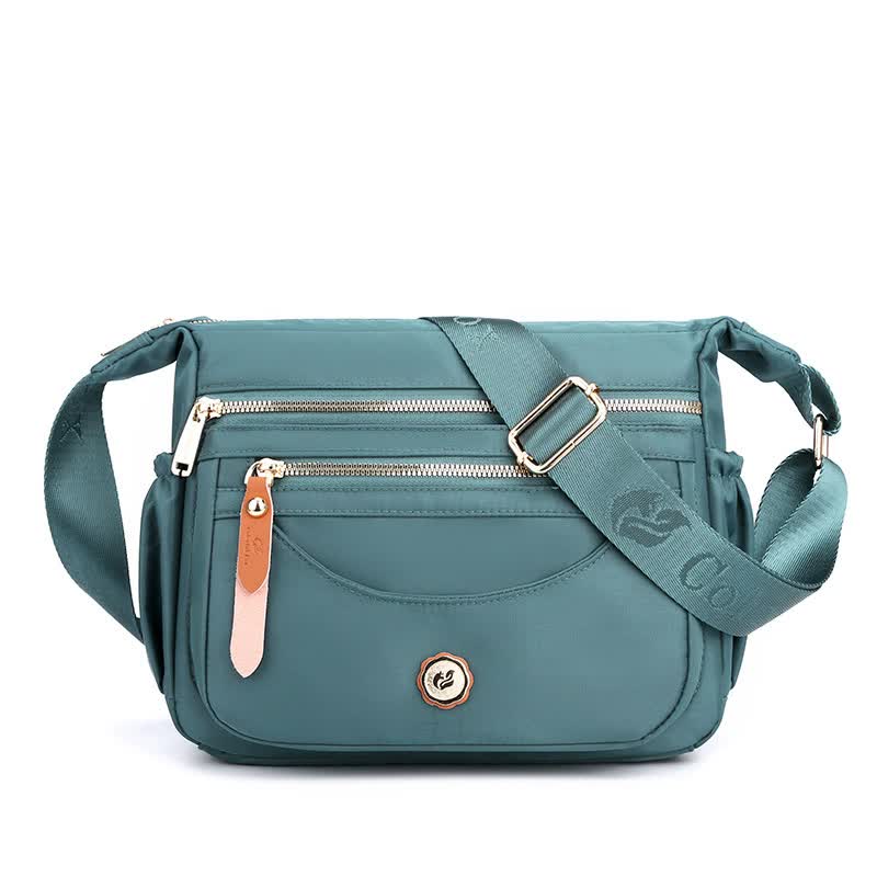 Light Blue Nylon Crossbody Bag with Multiple Compartments - Compact and Stylish Design